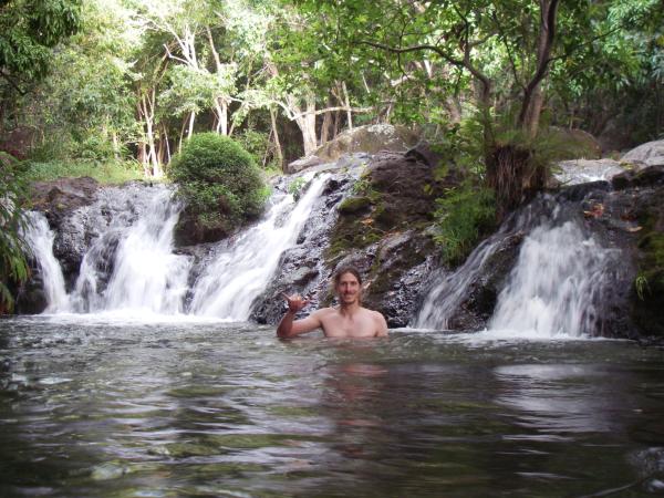 The author swimming in pool below some short cascades--great for back massage