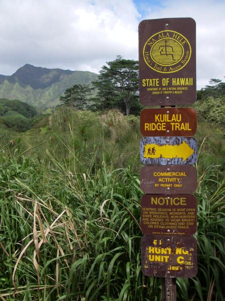 Trailhead sign that also forbids commercial activity and warns hikers about hunters