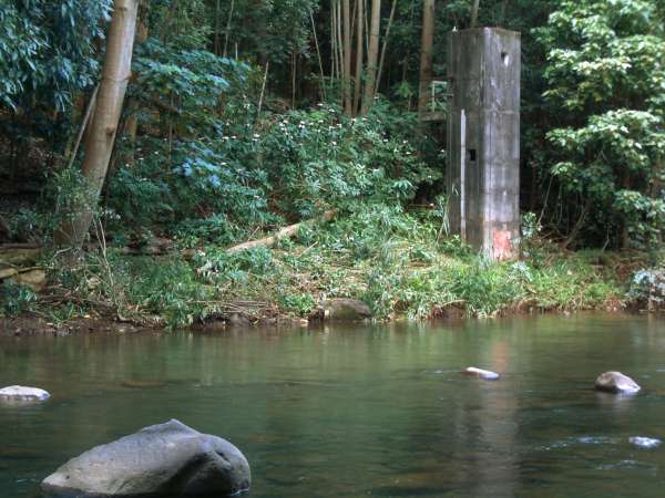 20 foot vertical cement tower on the other side of the Wailua river