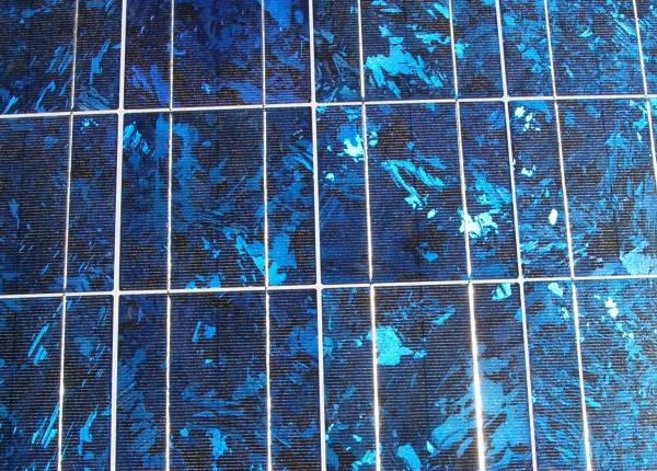 Close-up of a solar panel showing the silicon crystals