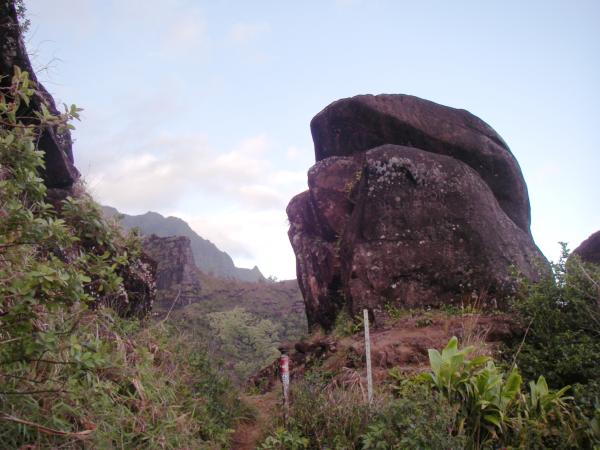 A 10-foot (3 m) boulder perched between the trail and a drop-off